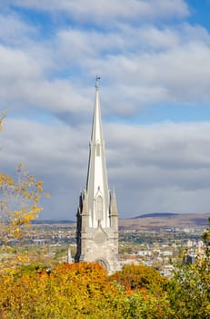 The spire of Chalmers-Wesley United Church in Upper Town of Old Quebec City during autumn season, Canada