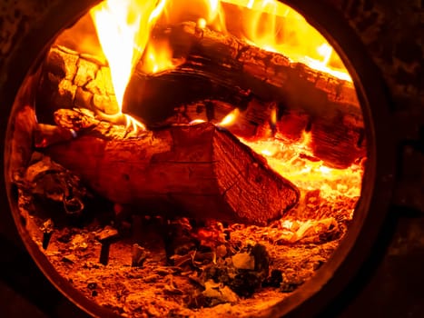 Fire flame on wood in a firebox. Background image.