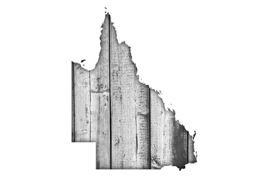 Map of Queensland on weathered wood