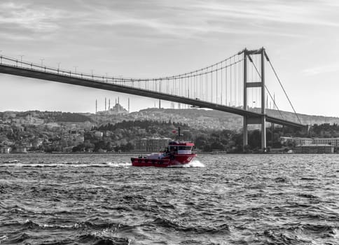 Turkish ship under the Bosphorus bridge of Istanbul, vintage style.