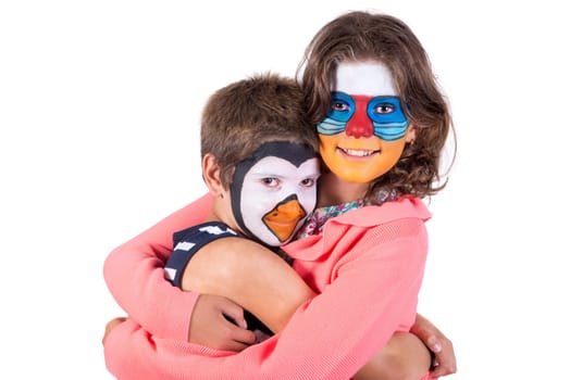 Children's couple with animal face-paint isolated in white