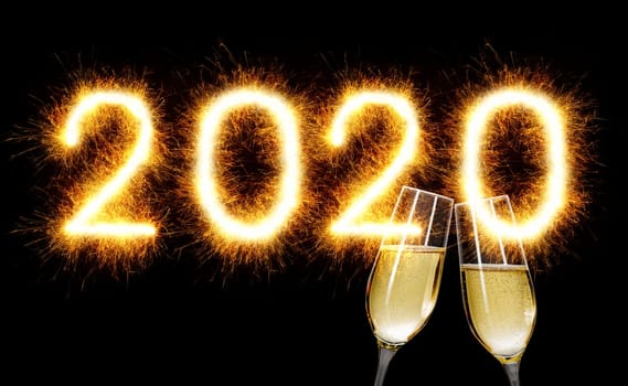 Sparkler with champagne glasses - Happy New Year 2020