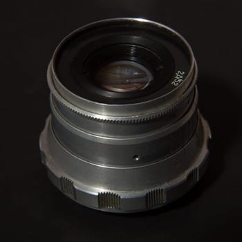 Retro Camera Lens on the black background