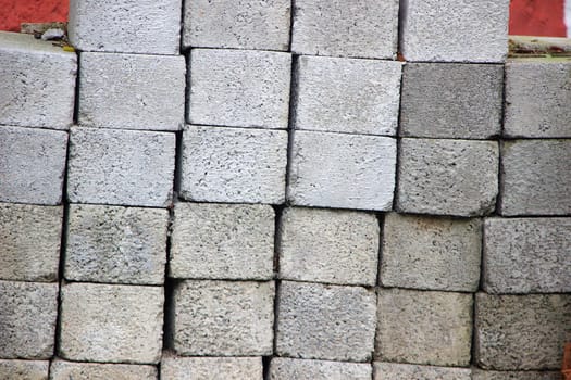 Frontal view of stack of concrete blocks piled up vertically