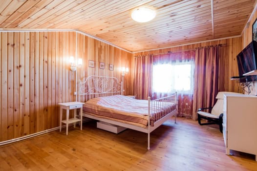 Russia, Moscow- July 06, 2019: interior room apartment. standard repair decoration in hostel. wooden finished country house