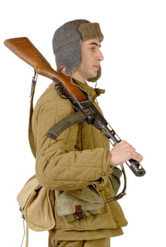 young Soviet soldier with machine gun on the white background
