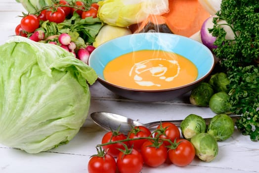 plate of soup with  several vegetables