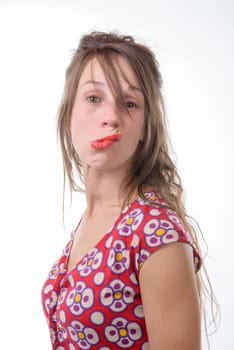 a young woman makes a grimace on the white background