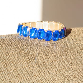 Blue jewel on the sun Lying on my sofa.