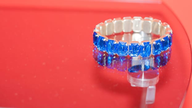 Blue jewel on the glass. sparkling blue