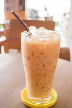 Glass of iced thai milk tea, stock photo