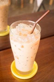 Glass of iced thai milk tea, stock photo