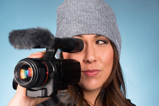 Horizontal Composition of Hip Young Adult Female Pointing Video Camera