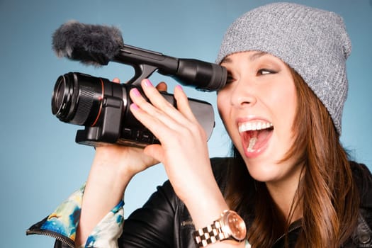 Horizontal Composition of Hip Young Adult Female Pointing Video Camera