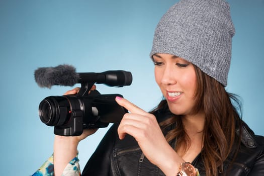 Horizontal Composition of Hip Young Adult Female Pointing Video Camera