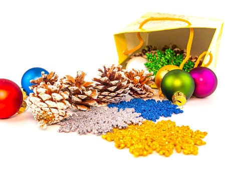Christmas present from Christmas toys on a white background with place for text. New Year's holidays. Background image. Free space for text.