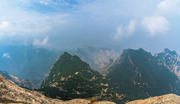 Panoramic view from the West Peak summit of the inspiring, sacred and majestic Huashan mountain, famous tourist attraction, Shaanxi province, China