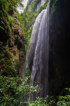 Giant Waterfall in a valley gorge in the Longshuixia Fissure National park, Wulong country, Chongqing, China