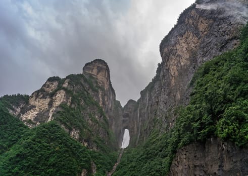 View of the holy sacred Tianmen Mountain on a rainy summer day, the Zhangjiajie National Park, Hunan Province, China