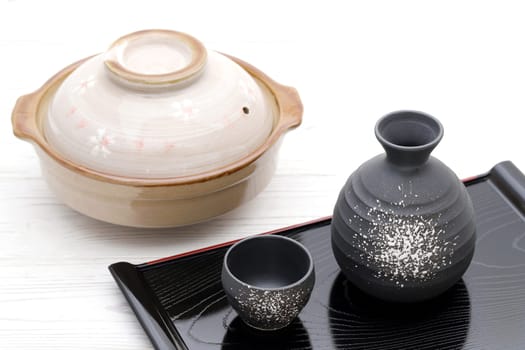 Japanese traditional sake cup and bottle on tray