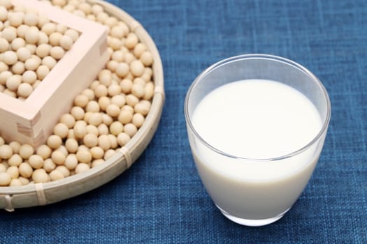 Glass of tonyu milk with soy bean on dining table