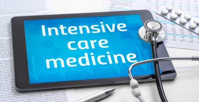 The word Intensive care medicine on the display of a tablet