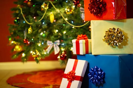 gift boxes with ribbon and bow on holiday lights background