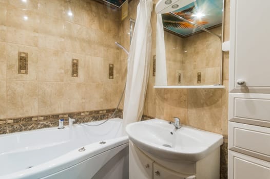 Russia, Moscow- July 16, 2019: interior room apartment. standard repair decoration in hostel. bathroom, sink, decoration elements, toilet
