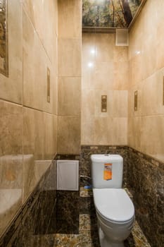 Russia, Moscow- July 16, 2019: interior room apartment. standard repair decoration in hostel. bathroom, sink, decoration elements, toilet