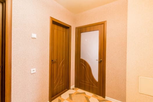 Russia, Moscow- July 16, 2019: interior room apartment. standard repair decoration in hostel. room doors, repair corridor