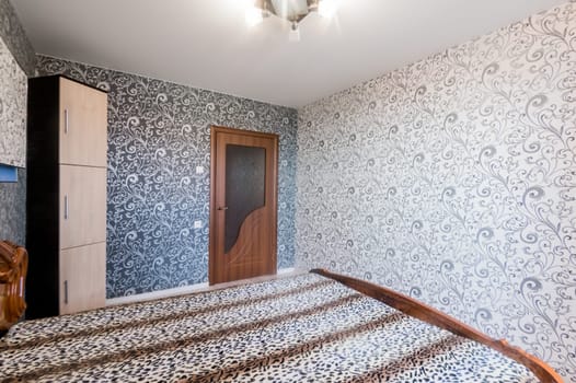 Russia, Moscow- July 16, 2019: interior room apartment. standard repair decoration in hostel. bedroom with bed
