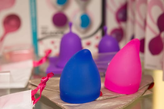 sex toys on a glass display in the store