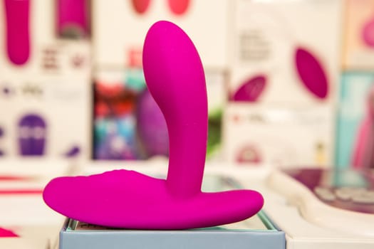sex toys on a glass display in the store