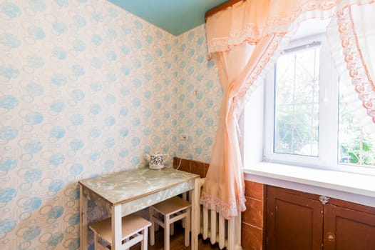 Russia, Moscow- July 16, 2019: interior room apartment. standard repair decoration in hostel. kitchen, dining area