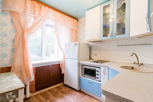 Russia, Moscow- July 16, 2019: interior room apartment. standard repair decoration in hostel. kitchen, dining area