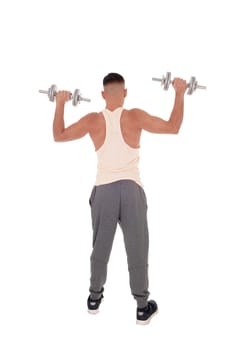 A young tall man standing from the back in his truck pants lifting up.two dumbbells, isolated for white background.