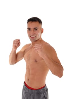 A handsome east Indian man standing without a shirt making fists.with his hands mimic boxing, isolated for white background.