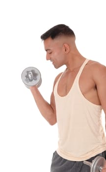 A handsome young man working out with two dumbbell with his.eyes closed, wearing his truck pants, isolated for white background.