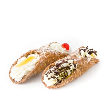 Two cannoli pastries. Traditional Sicilian dessert, filled with a rich ricotta cream enriched with chocolate grain and candied fruit.