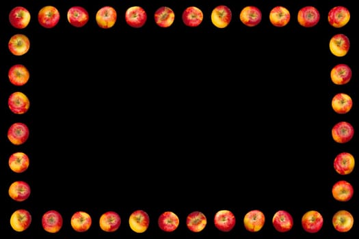 Frame of apples isolated on a black background.