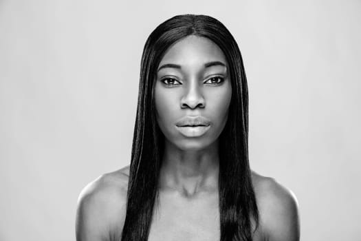 Face of an young black beauty in black and white
