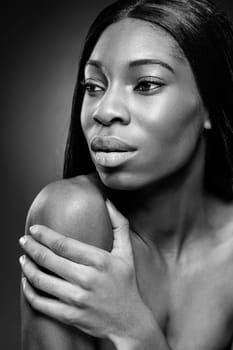 Face of an young black beauty in black and white
