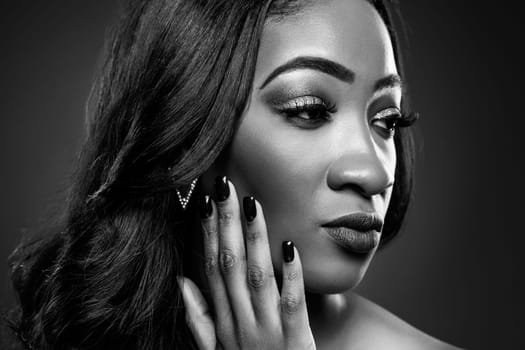 Face of an young black beauty in black and white