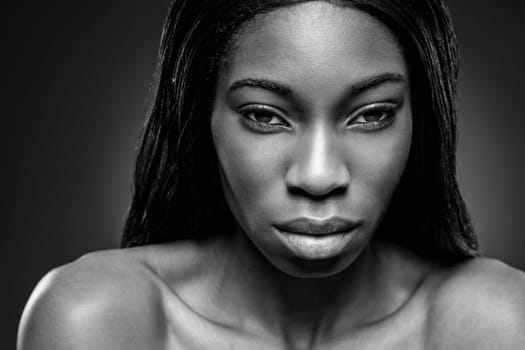 Face of an young black beauty in black and white