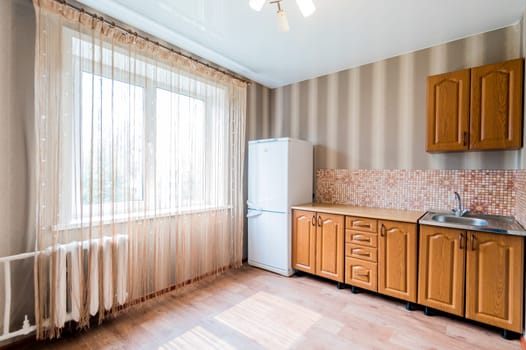 Russia, Moscow- July 23, 2019: interior room apartment. standard repair decoration in hostel. kitchen and dining room