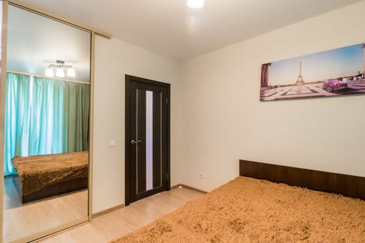 Russia, Moscow- July 08, 2019: interior room apartment. standard repair decoration in hostel. bedroom with bed