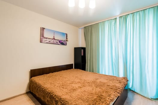 Russia, Moscow- July 08, 2019: interior room apartment. standard repair decoration in hostel. bedroom with bed