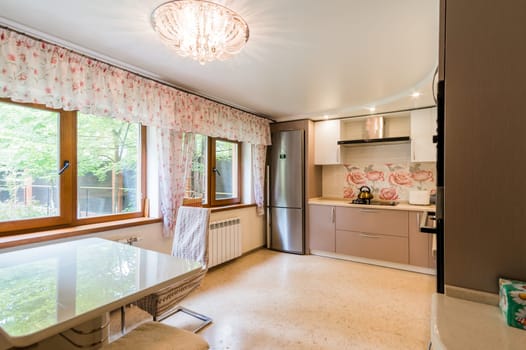 Russia, Moscow- July 23, 2019: interior room apartment. standard repair decoration in hostel. kitchen and dining room
