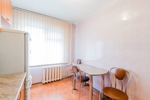 Russia, Moscow- July 23, 2019: interior room apartment. standard repair decoration in hostel. kitchen and dining room