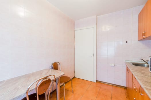 Russia, Moscow- July 23, 2019: interior room apartment. standard repair decoration in hostel. kitchen and dining room